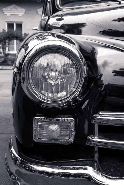 Retro car festival. Retro car headlight. Fragment of the front of a retro car. - Photo, Image