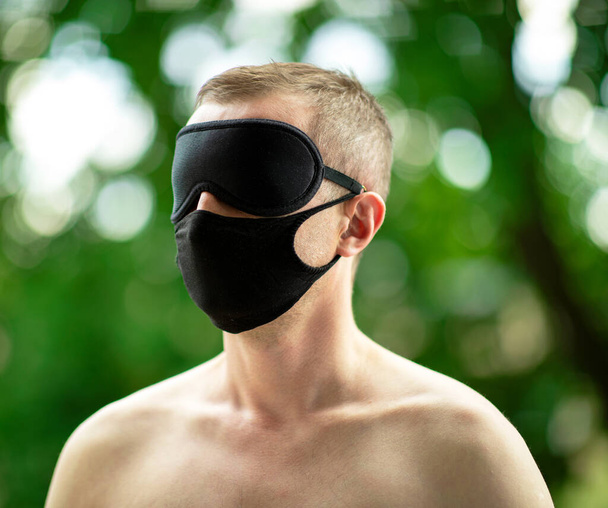Covid - man. A lonely man during the virus pandemic. The mask becomes his everyday attribute. However, due to limitations in travel and interpersonal contacts, man becomes blind, surrounded by the beauty of nature - Fotó, kép