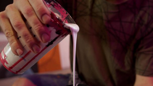 A talented painter is filtering paints  - Photo, Image