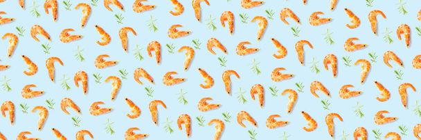 Tiger shrimp. Seafood background made from Prawns isolated on a blue backdrop. modern background from boiled shrimps, Seafood. not seamless pattern - Fotó, kép