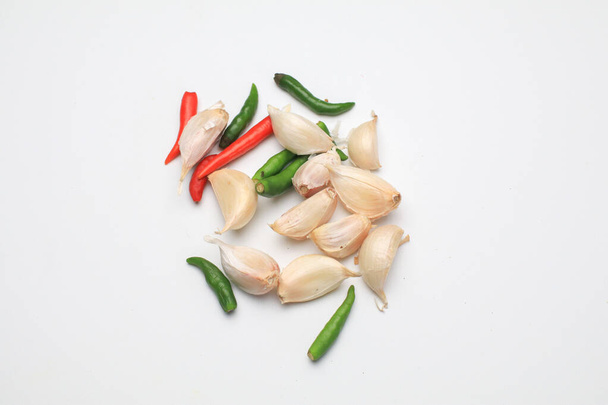Garlic and chili for cooking food. Isolated on white. copy space. Cooking spicy ingredient. - Фото, зображення