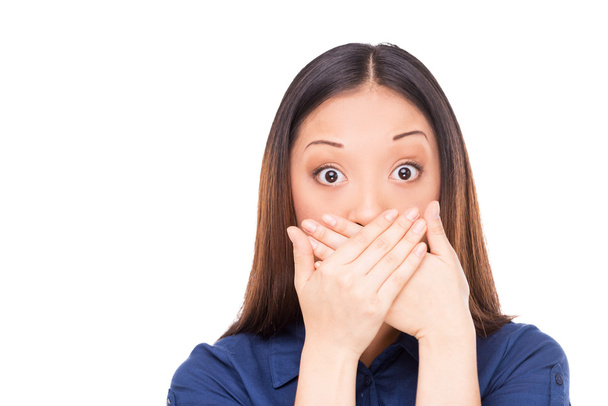 Asian woman covering mouth with hands - 写真・画像