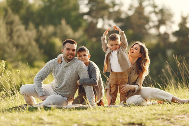 Cute family playing in a summer field - Photo, image