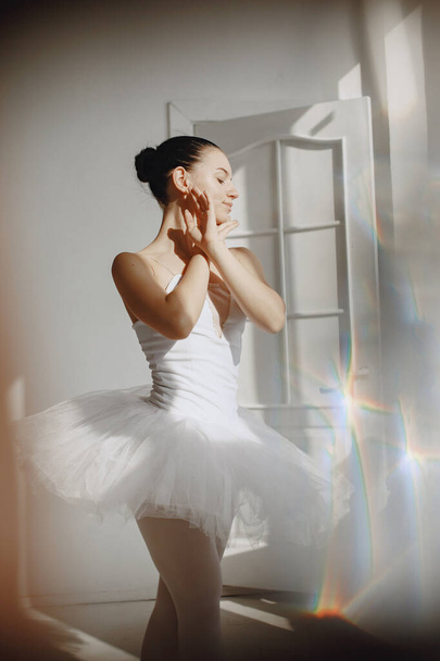 Ballerina posing in front of white background - Foto, immagini