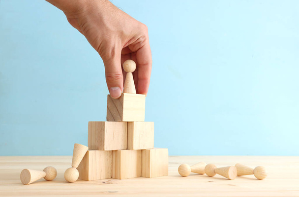 business concept image of people figures over wooden blocks and table, human resources and management concept - 写真・画像
