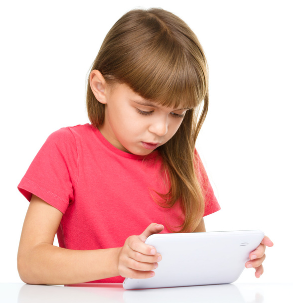 Young girl is using tablet - Zdjęcie, obraz