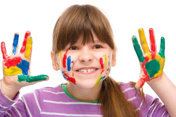 Portrait of a cute girl playing with paints - Fotoğraf, Görsel