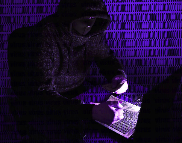 Man in hoodie is hacking personal data. Information security. Protection of information concept. Bad password. - Photo, Image