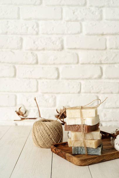 Natural organic cosmetics. Stack of hand made soap on white wooden background - Φωτογραφία, εικόνα