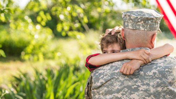 Happy reunion of soldier with family outdoors - Foto, Imagem