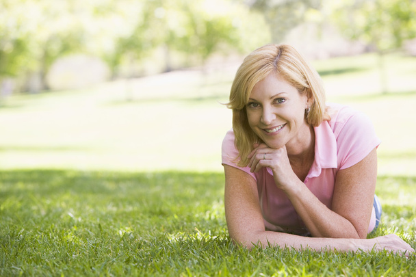 Woman relaxing outdoors smiling - Fotografie, Obrázek