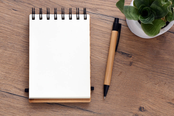 Blank notepad  on office wooden table - Photo, Image