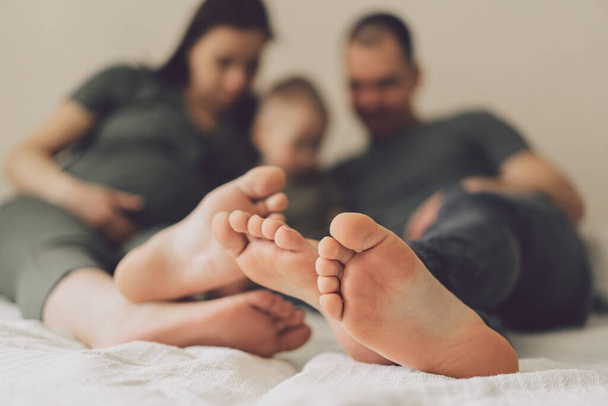 Family Love. Parents and Little Son, Having Fun Together At Home In Bed Room. Family life is about fun. - Photo, image