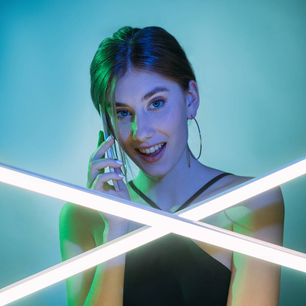 phone call mobile communication blue neon woman - 写真・画像