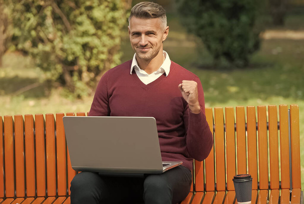 successful business man working on computer with morning coffee outdoor, success - Foto, Imagen