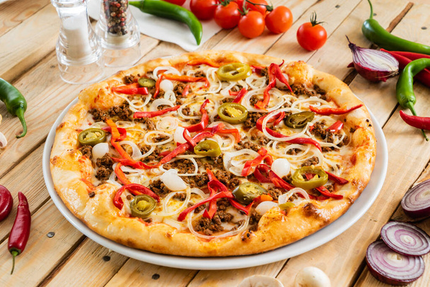 tasty pizza on the wooden background - Photo, Image