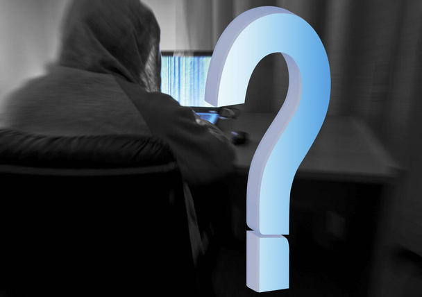 blurred image from behind of an hacker with a sweatshirt and hood raised alone in his room using a laptop. for cyber security concept - Photo, Image