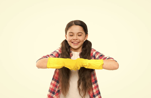 Cleaning supplies. Girl rubber gloves for cleaning white background. Teach kid appreciate cleanliness. Big cleaning day. Careful and diligent helper. Make your world spotless. Housekeeping duties - Foto, imagen