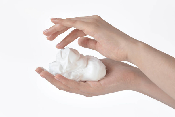 white bubbled foam in hands, hair foam, foam for man, white textured, hand full of soap isolated on white background, finger touches cream - Foto, Bild