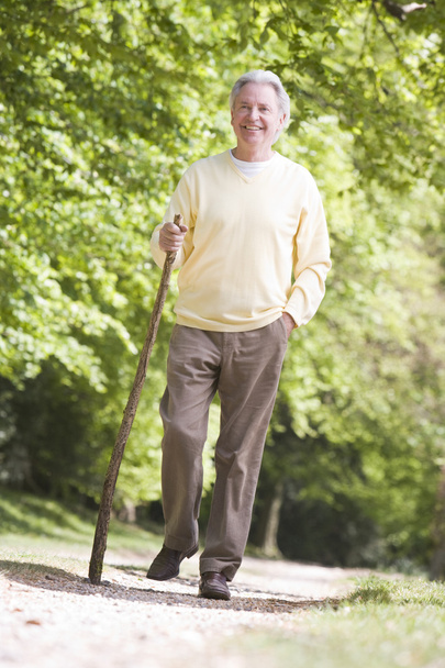 Man walking outdoors smiling - Zdjęcie, obraz