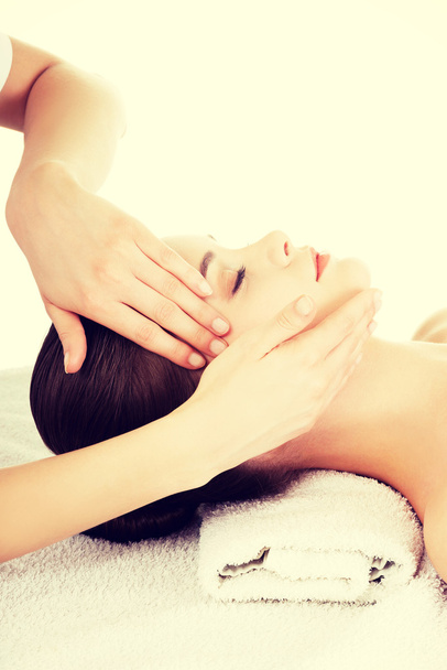 Relaxed woman enjoy receiving face massage - Photo, image