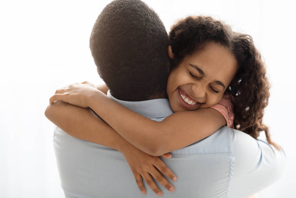 Emotional black girl hugging her daddy, closeup - Photo, Image