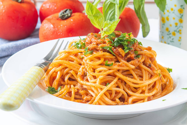 homemade bolognese spaghetti on pan with herbs - Foto, imagen