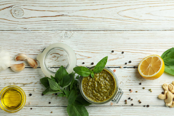 Pesto sauce and ingredients for cooking on wooden background - Photo, Image