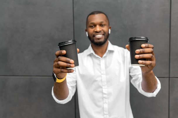 young african american man with coffee cups - Photo, Image