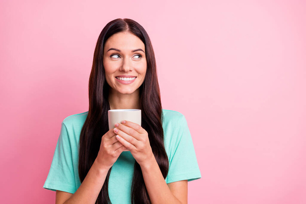 Photo of young attractive happy positive smiling girl drinking tea look copyspace isolated on pink color background - Valokuva, kuva