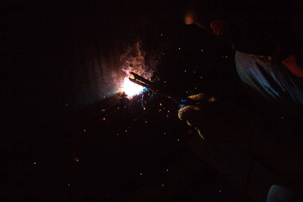 blacksmith work in the dark - Photo, Image