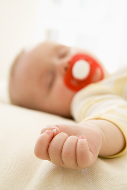 Baby lying indoors sleeping - Фото, изображение