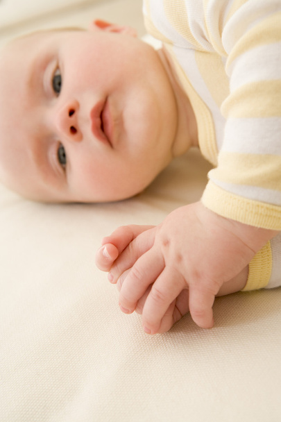 Baby lying indoors - Фото, изображение