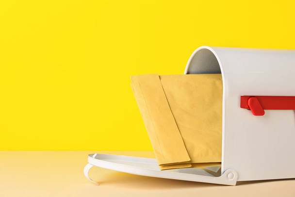 Mail box with letter on color background - Photo, Image