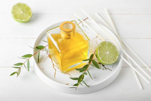 Reed diffuser with lime on white background - Photo, Image