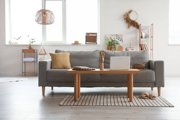 Stylish interior of living room with cozy sofa - Photo, Image