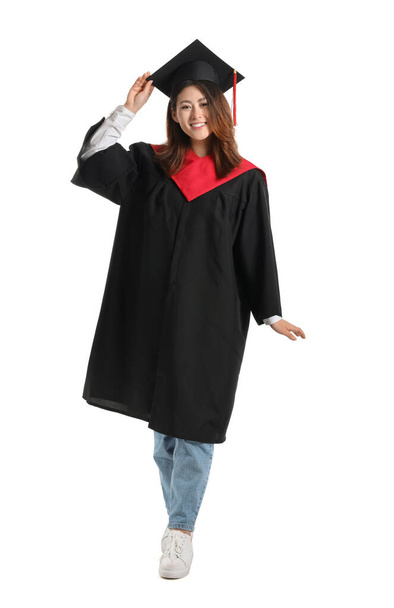 Female graduating student on white background - Фото, изображение