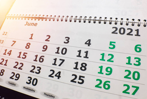 Calendar for the month of June 2021, wall calendar with a spiral on the background of sunlight, light up. - Photo, Image