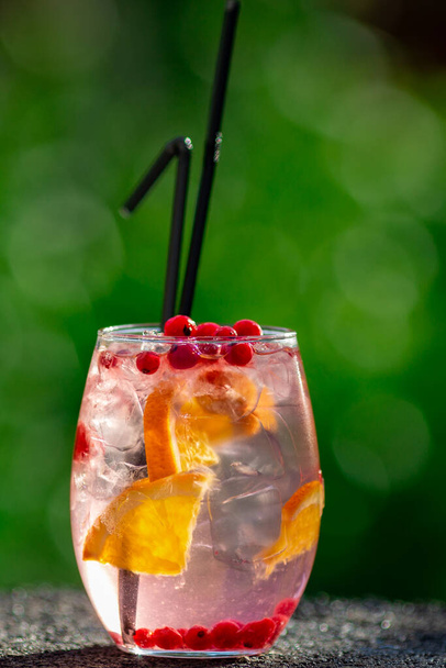 summer cocktail on green background - 写真・画像