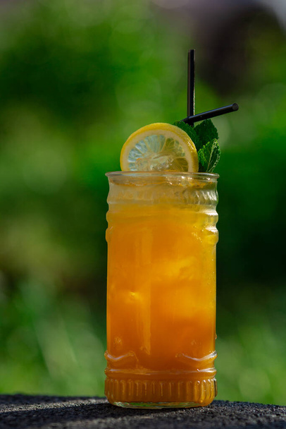 summer cocktail on green background - Фото, изображение