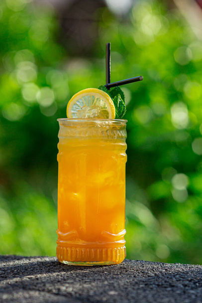 summer cocktail on green background - Фото, изображение