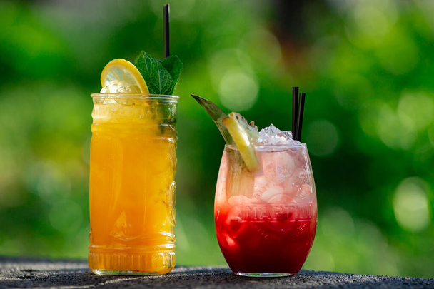 summer cocktails on green background - Фото, изображение