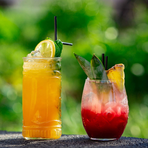 summer cocktails on green background - Фото, изображение