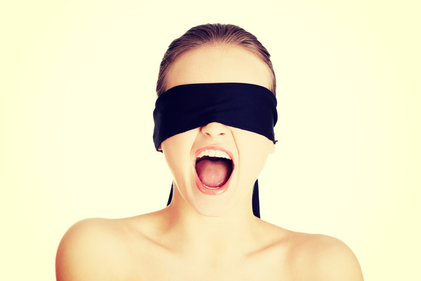 Blindfold woman screaming - Foto, afbeelding
