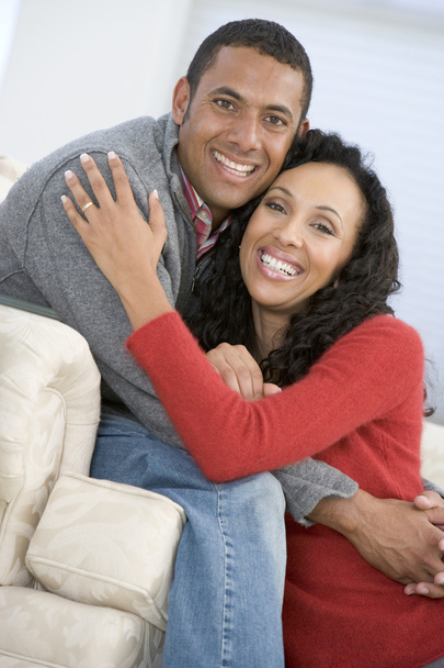 Couple in living room smiling - Foto, imagen