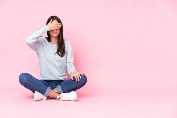 Young caucasian woman isolated on pink background covering eyes by hands. Do not want to see something - Photo, Image