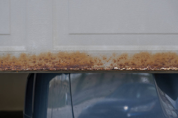 Half opened Garage door with rust at bottom - Photo, Image