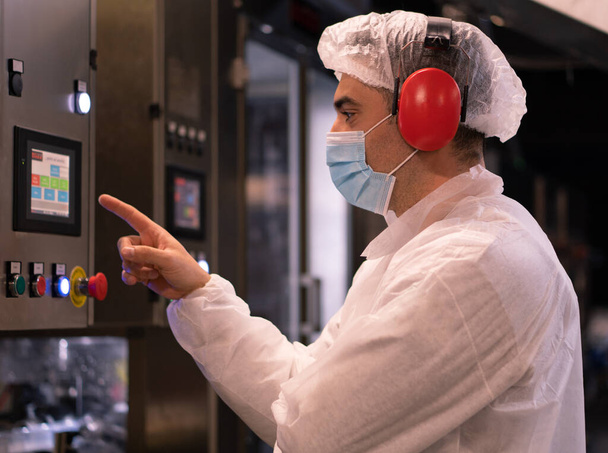 CAPUA, ITALY - Jun 05, 2021: Food technician working in a food processing plant - Photo, image