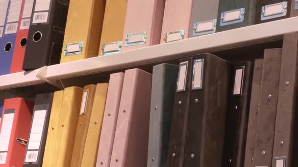 Closeup shot of storage folders for documents in shelves. - Footage, Video
