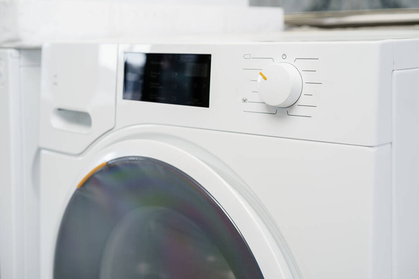 New washing machine in a home appliances store - Photo, image